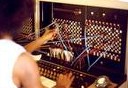 An operator connecting calls at a vintage telephone switchboard